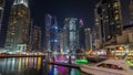 Dubai marina bay with yachts an boats night timelapse hyperlapse Royalty Free Stock Photo