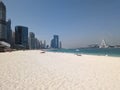 Dubai Marina beach during the day, few people, beautiful view of the Ferris wheel