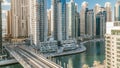 Dubai Marina at evening timelapse with trails of boats on the water and cars traffic, Dubai, UAE Royalty Free Stock Photo