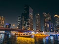 Dubai Marina, harbour, cruise boat and canal promenade view at night, in Dubai, United Arab Emirates Royalty Free Stock Photo