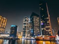 Dubai Marina, harbour, cruise boat and canal promenade view at night, in Dubai, United Arab Emirates Royalty Free Stock Photo