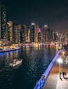 Dubai Marina, harbour, cruise boat and canal promenade view at night, in Dubai, United Arab Emirates Royalty Free Stock Photo