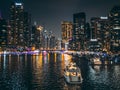 Dubai Marina, harbour, cruise boat and canal promenade view at night, in Dubai, United Arab Emirates Royalty Free Stock Photo