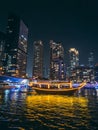 Dubai Marina, harbour, cruise boat and canal promenade view at night, in Dubai, United Arab Emirates Royalty Free Stock Photo