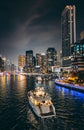 Dubai Marina, harbour, cruise boat and canal promenade view at night, in Dubai, United Arab Emirates Royalty Free Stock Photo
