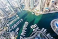 Dubai Marina and Harbour luxury wealth travel with boats yacht in United Arab Emirates from above Royalty Free Stock Photo