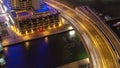 Dubai Marina at night aerial view to canal with boats and bridge with traffic timelapse near hotel Royalty Free Stock Photo