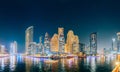 Dubai Marina Port, UAE, United Arab Emirates - May 19, 2021: Beautiful Night view of high-rise buildings of residential Royalty Free Stock Photo