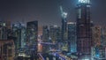 Dubai Marina with several boat and yachts parked in harbor and skyscrapers around canal aerial night timelapse. Royalty Free Stock Photo