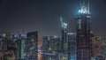 Dubai Marina with several boat and yachts parked in harbor and skyscrapers around canal aerial night timelapse. Royalty Free Stock Photo