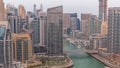 Dubai Marina with several boat and yachts parked in harbor and skyscrapers around canal aerial day to night timelapse. Royalty Free Stock Photo