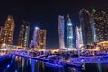 Dubai marina skyline at night with boats in the harbor, United Arab Emirates Royalty Free Stock Photo