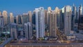 Dubai Marina skyscrapers aerial top view during sunrise from JLT in Dubai night to day timelapse, UAE. Royalty Free Stock Photo