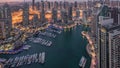 Dubai Marina skyscrapers and jumeirah lake towers view from the top aerial night to day timelapse in the United Arab Royalty Free Stock Photo