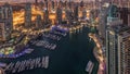 Dubai Marina skyscrapers and jumeirah lake towers view from the top aerial night to day timelapse in the United Arab Royalty Free Stock Photo