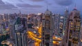 Dubai Marina skyscrapers and jumeirah lake towers view from the top aerial night to day timelapse in the United Arab Royalty Free Stock Photo