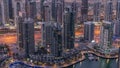 Dubai Marina skyscrapers and jumeirah lake towers view from the top aerial night to day timelapse in the United Arab Royalty Free Stock Photo