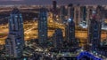 Dubai Marina skyscrapers and jumeirah lake towers view from the top aerial night to day timelapse in the United Arab Royalty Free Stock Photo