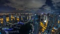 Dubai Marina skyscrapers and jumeirah lake towers view from the top aerial night to day timelapse in the United Arab Royalty Free Stock Photo