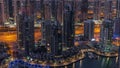 Dubai Marina skyscrapers and jumeirah lake towers view from the top aerial night to day timelapse in the United Arab Royalty Free Stock Photo