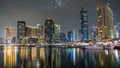 Dubai Marina towers and yacht in Dubai at night timelapse hyperlapse Royalty Free Stock Photo