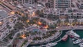 Dubai Marina Walk with fountain and palms aerial Top View night to day timelapse