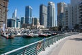 Dubai Marina Yacht Club along walkway with speed and pleasure boats in the skyline and harbour near Jumeriah