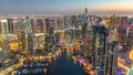 Dubai Marina with modern towers from top of skyscraper transition from day to night timelapse Royalty Free Stock Photo