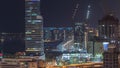 Dubai media city skyscrapers and construction site on palm jumeirah night timelapse, Dubai, United Arab Emirates Royalty Free Stock Photo