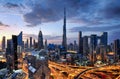 Dubai modern skyline architecture by night with illuminated skyscrapers, United Arab Emirates