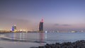 Dubai skyline with Burj Al Arab hotel during and day to night timelapse. Royalty Free Stock Photo
