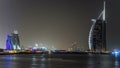 Dubai skyline with Burj Al Arab hotel at night timelapse. Royalty Free Stock Photo
