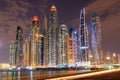 Dubai skyline at night with lights on the water and luxirious skyscrapers of UAE Royalty Free Stock Photo