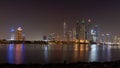 Dubai skyline at night with lights on the water and luxirious skyscrapers of UAE Royalty Free Stock Photo