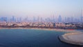 Dubai skyline view from coast or beach with city landscape and skyscrapers with Burj Khalifa background. Amazing aerial Royalty Free Stock Photo