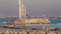 Dubai skyline with villas and Burj Al Arab during sunset timelapse. Royalty Free Stock Photo