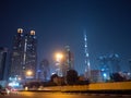 Dubai skyscrapers at night with road at night. Royalty Free Stock Photo