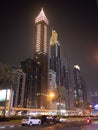 Dubai skyscrapers at night with road traffic late at night. Royalty Free Stock Photo