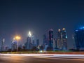 Dubai skyscrapers at night with road traffic late at night. Royalty Free Stock Photo