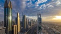 Dubai skyscrapers sunset timelapse evening time. Dubai Metro station and traffic on Sheikh Zayed Road Royalty Free Stock Photo