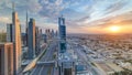 Dubai skyscrapers sunset timelapse evening time. Dubai Metro station and traffic on Sheikh Zayed Road