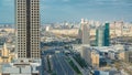 Dubai skyscrapers timelapse evening sunset time. Dubai Metro station and traffic on Sheikh Zayed Road Royalty Free Stock Photo