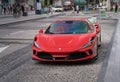 Red Ferrari parked in JBR Beach area of Dubai for rental