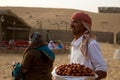 DUBAI, UAE - APRIL 20, 2012: Staff at a safari camp prepares food in preparation for tourists arriving after dune bashing
