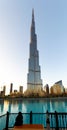 Dubai. UAE. Burj Khalifa. A veiled woman on a bench