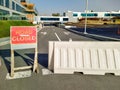 Dubai, UAE - CIRCA 2020: Road closer sign and road blockade near a hospital. Concept of road diversion