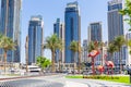 Dubai Creek Harbour promenade and skyline with palm trees and big flamingos sculptures