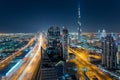 DUBAI, UAE - DECEMBER 17, 2015: Aerial view of Dubai's downtown architecture at night with and Burj Khalifa