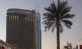 Emaar building in Dubai in front of the Dubai Mall, with an illuminated palm Royalty Free Stock Photo