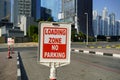 Dubai UAE December 2019 Red and white sign for no parking in the loading zone outside a building. Residential and commercial area